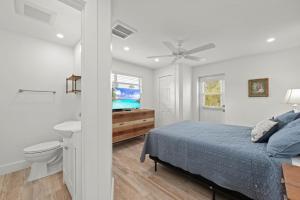 Ένα ή περισσότερα κρεβάτια σε δωμάτιο στο Beach Road Bungalow +37 φωτογραφίες