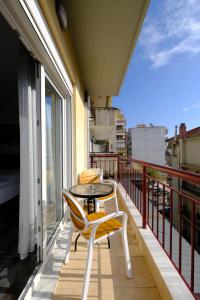 a balcony with a table and chairs on a balcony at Eva House 1 in Drama +14 photos