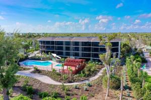 an aerial view of a resort with a swimming pool at Pine Cove 104 in Sanibel