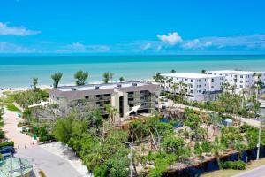 an aerial view of the resort with the ocean in the background at Pine Cove 104 in Sanibel