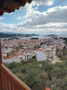 a view of a city from a balcony at Villa Makis Studios in Skiathos Town
