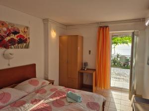 Postel nebo postele na pokoji v ubytování Apartman i sobe Martina