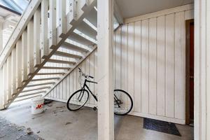 a bike parked next to a wall with stairs at Town & Country in Ketchum