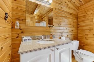 a bathroom with a sink and a toilet at Moose Cabin in Bridgton +45 photos