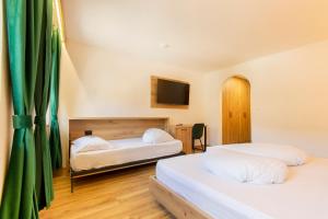 Voodi või voodid majutusasutuse Gasthof Goldenes Lamm toas