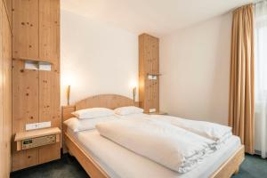 Posteľ alebo postele v izbe v ubytovaní Appartements Aurikel Corso