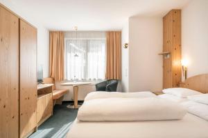 Posteľ alebo postele v izbe v ubytovaní Appartements Aurikel Corso