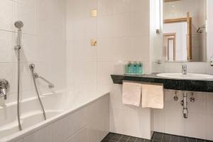 Kúpeľňa v ubytovaní Appartements Aurikel Corso