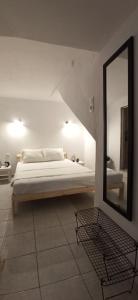 A bed or beds in a room at Pythagora