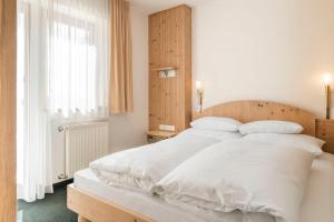 Posteľ alebo postele v izbe v ubytovaní Appartements Aurikel Corso