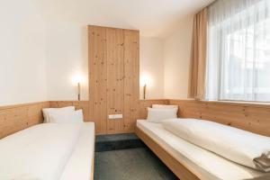 Posteľ alebo postele v izbe v ubytovaní Appartements Aurikel Corso