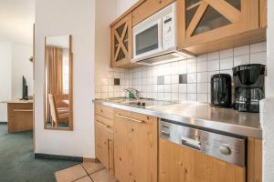 Kuchyňa alebo kuchynka v ubytovaní Appartements Aurikel Corso