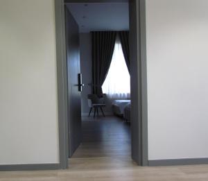 Postel nebo postele na pokoji v ubytování Rooms at Mimosa Street