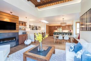 a living room with a couch and a table at Skyline at Meribel by Exceptional Stays in Telluride