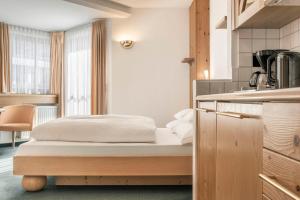 Posteľ alebo postele v izbe v ubytovaní Appartements Aurikel Corso