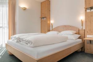 Posteľ alebo postele v izbe v ubytovaní Appartements Aurikel Corso