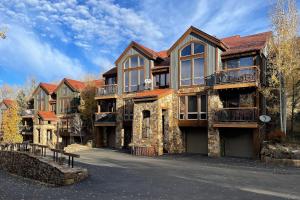 a large house with a driveway in front of it at Terraces 602 by Exceptional Stays in Telluride