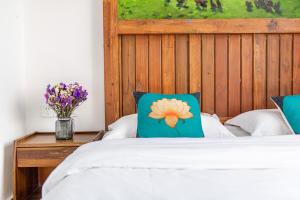 Ein Bett oder Betten in einem Zimmer der Unterkunft Breeze Alley Inn--English reception-Tourism planing