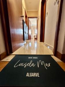 a welcome mat on the floor of a hotel hallway at Luisela Mar Algarve in Carvoeiro +41 photos