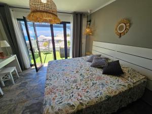 Postel nebo postele na pokoji v ubytování Casa Mykonos 1° linea de mar en Playa Blanca