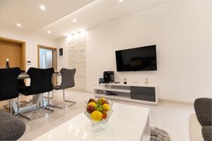 TV a/nebo společenská místnost v ubytování Luxury Apartment Aria