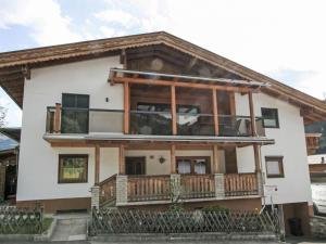 a house with a large balcony on top of it at Apartment Manuel by Interhome in Hippach