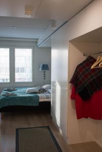 Ένα ή περισσότερα κρεβάτια σε δωμάτιο στο Lahti City Home 3