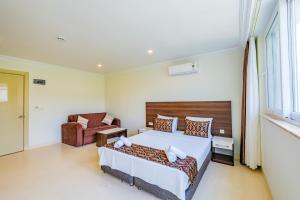 Кровать или кровати в номере La Moda Beach Hotel
