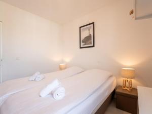 Postel nebo postele na pokoji v ubytování Holiday Home New Dahlia 17 by Interhome