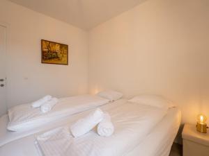 Postel nebo postele na pokoji v ubytování Holiday Home New Dahlia 17 by Interhome + 10 fotografií