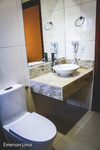 a bathroom with a sink and a toilet at Casa do Pico in Santo Antônio do Pinhal +84 photos