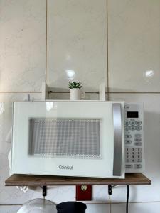 Kuchyň nebo kuchyňský kout v ubytování Cantinho da Natureza Aconchego no Centro