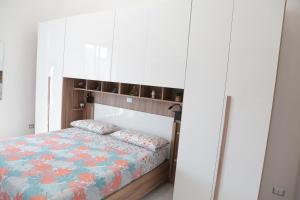 Ένα ή περισσότερα κρεβάτια σε δωμάτιο στο Casa Cinzia