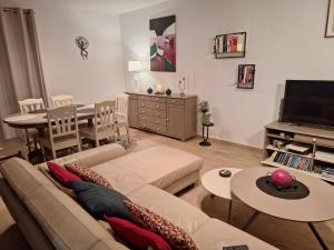 a living room with a couch and a table at exceptionnel penthouse vue mer in Wimereux