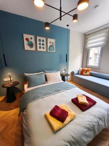 a bedroom with a large bed with towels on it at La Casa Privada in Istanbul