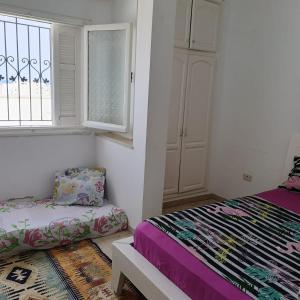 Katil atau katil-katil dalam bilik di Appartement joury