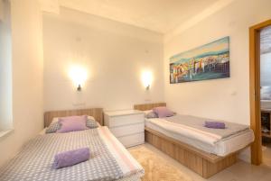 Postel nebo postele na pokoji v ubytování Luxury Apartment Aria