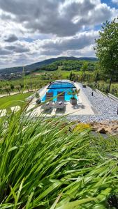 a swimming pool in a yard with at Owocowe Wzgórze in Tęgoborze