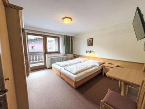 En eller flere senge i et værelse på Apartment Schachner-2 by Interhome