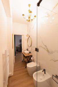 a bathroom with a toilet and a sink at Regina House al centro di Cagliari in Cagliari