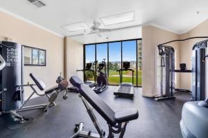 a gym with two treadmills and two exercise bikes at 6512 Gulf Shores Plantation-Palms in Gulf Shores