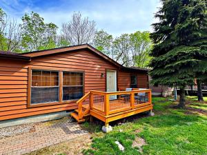 a small house with a porch in front of it at Put-in-Bay Island Club #74 in Put-in-Bay