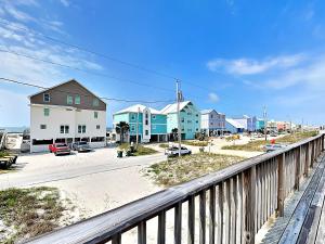 a view of a beach with houses and a balcony at Bets Kept Secret in Fort Morgan