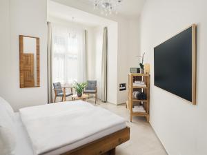 Postel nebo postele na pokoji v ubytování IMPERIAL Apartments