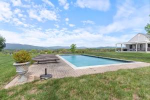 a swimming pool in the middle of a yard at Rustic Baileys Retreat Cabin Near Wineries! in Crozet +26 photos