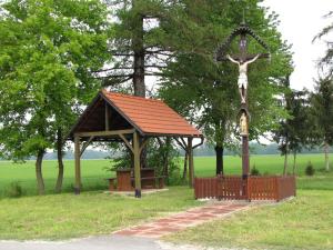 a statue of a cross on top of a gazebo at Atera in Banovci