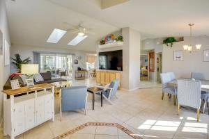 a dining room and living room with a table and chairs at Private Pool and Park Access Cozy South Daytona Gem in South Daytona