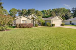 a house with a large lawn in front of it at Private Pool and Park Access Cozy South Daytona Gem in South Daytona