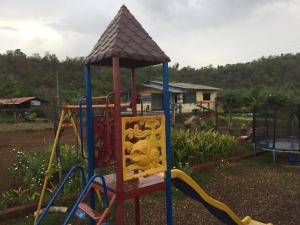 a playground with a slide in a yard at Raigad Agro Park in Mahād