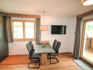 a dining room with a table and chairs at Apartment Familienglück by Interhome in Oberau